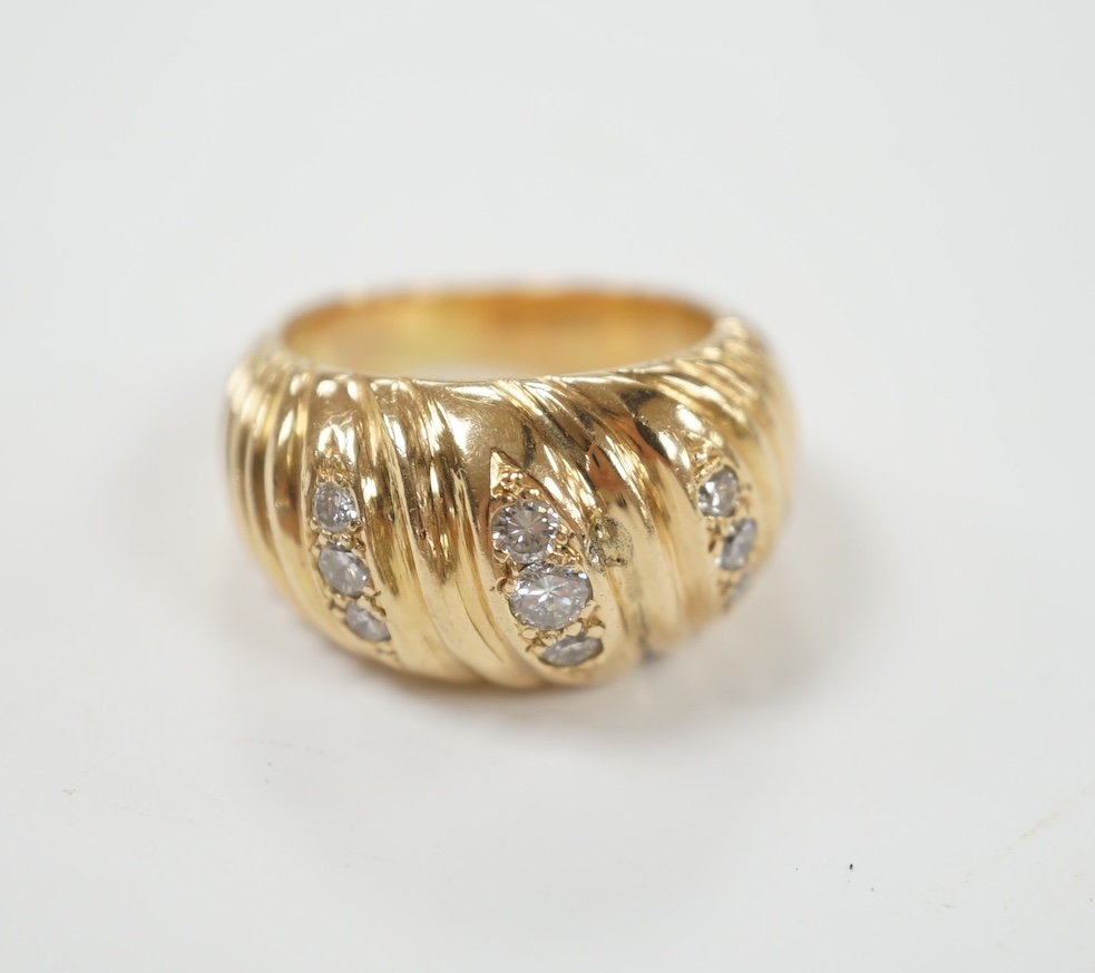 A fluted yellow metal and three row, nine stone diamond set dress ring, size H, gross weight 16 grams.